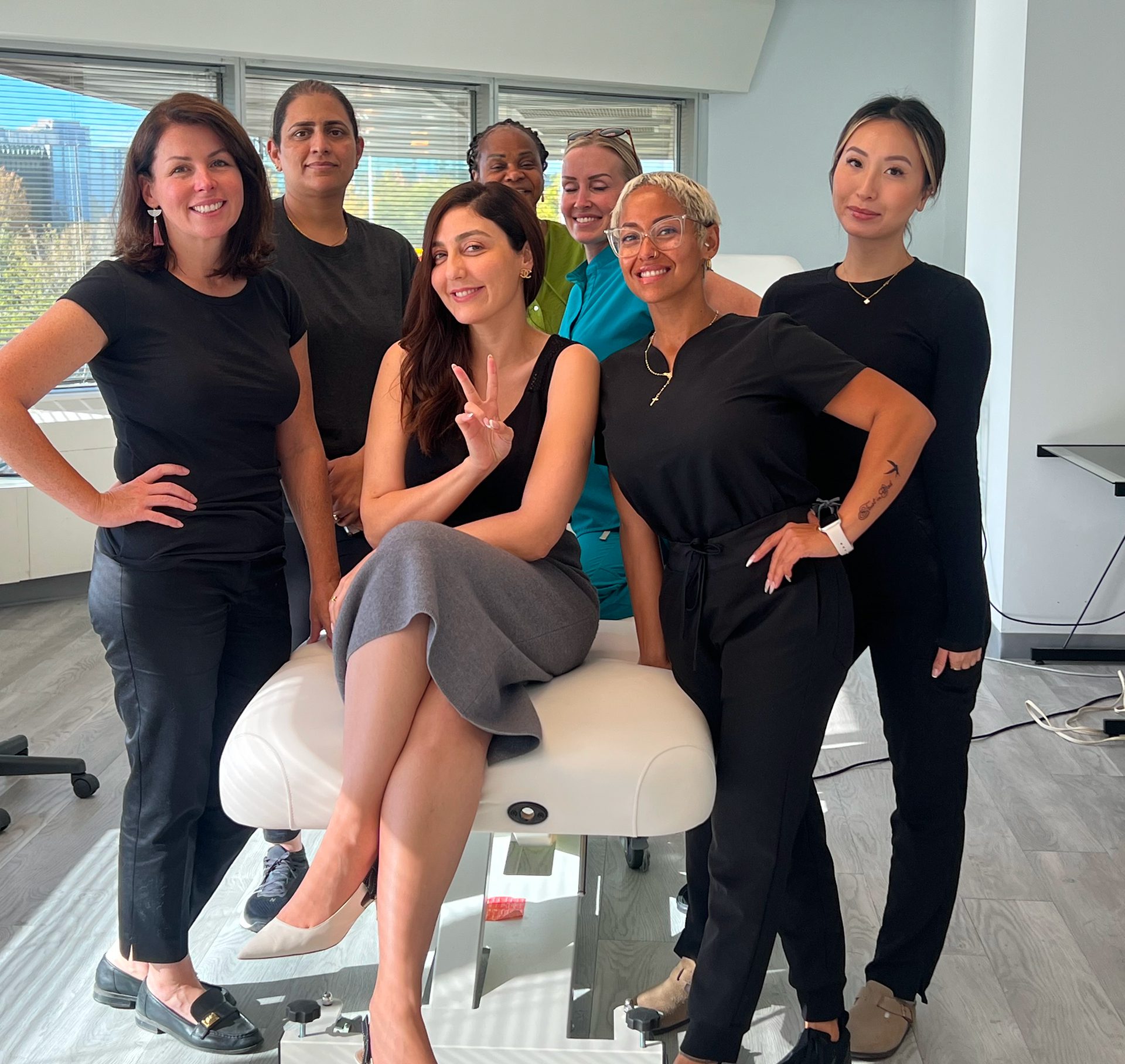 Dr. Owlia Aesthetics injector training course participants posing together in the training clinic