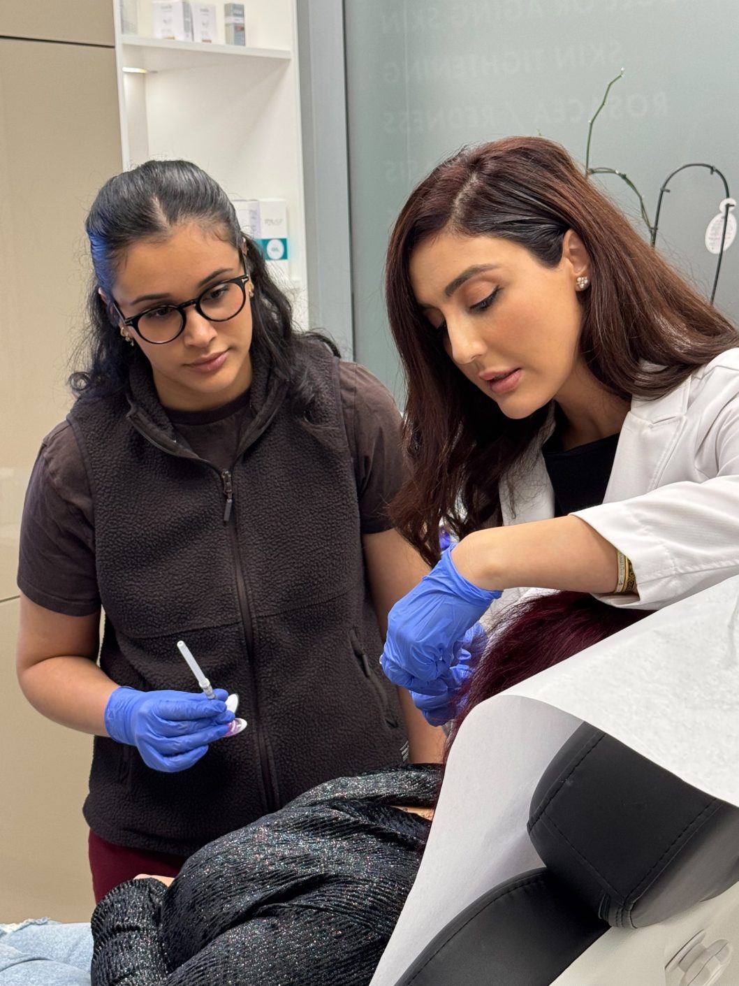 Biostimulator injection technique masterclass — Dr. Aida Owlia showing a trainee technique on a reclined model