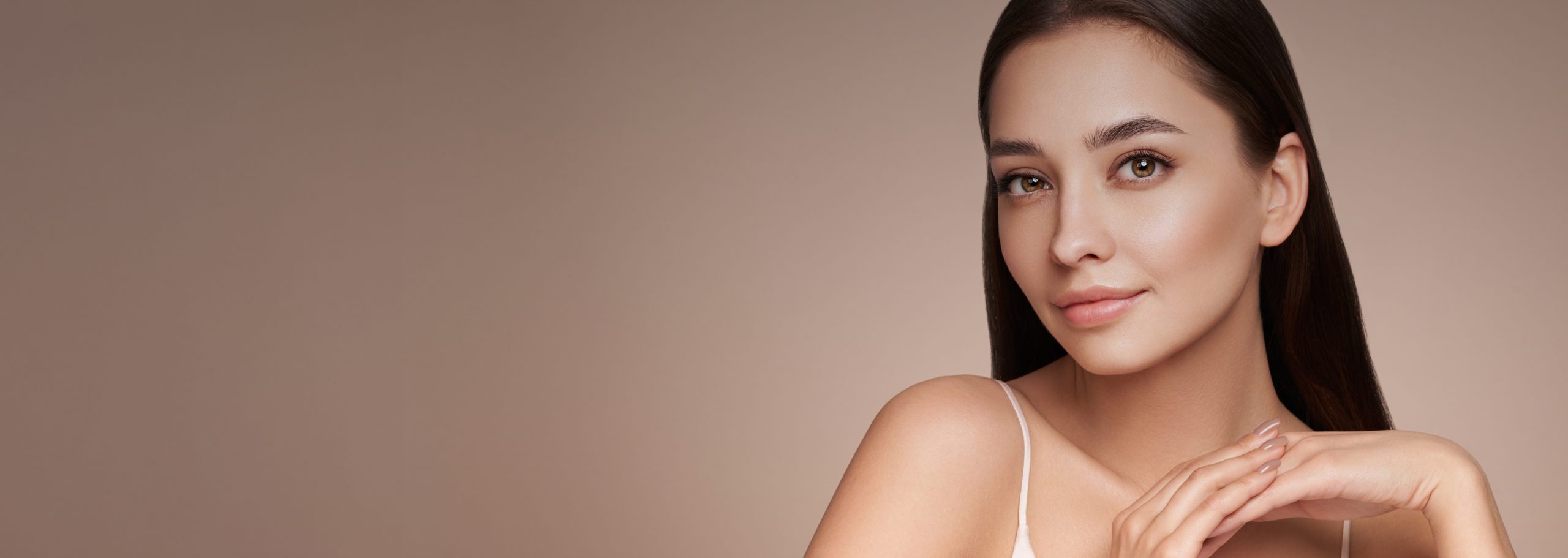 Consultation Process at Dr. Owlia Aesthetics — woman with smooth, even skin