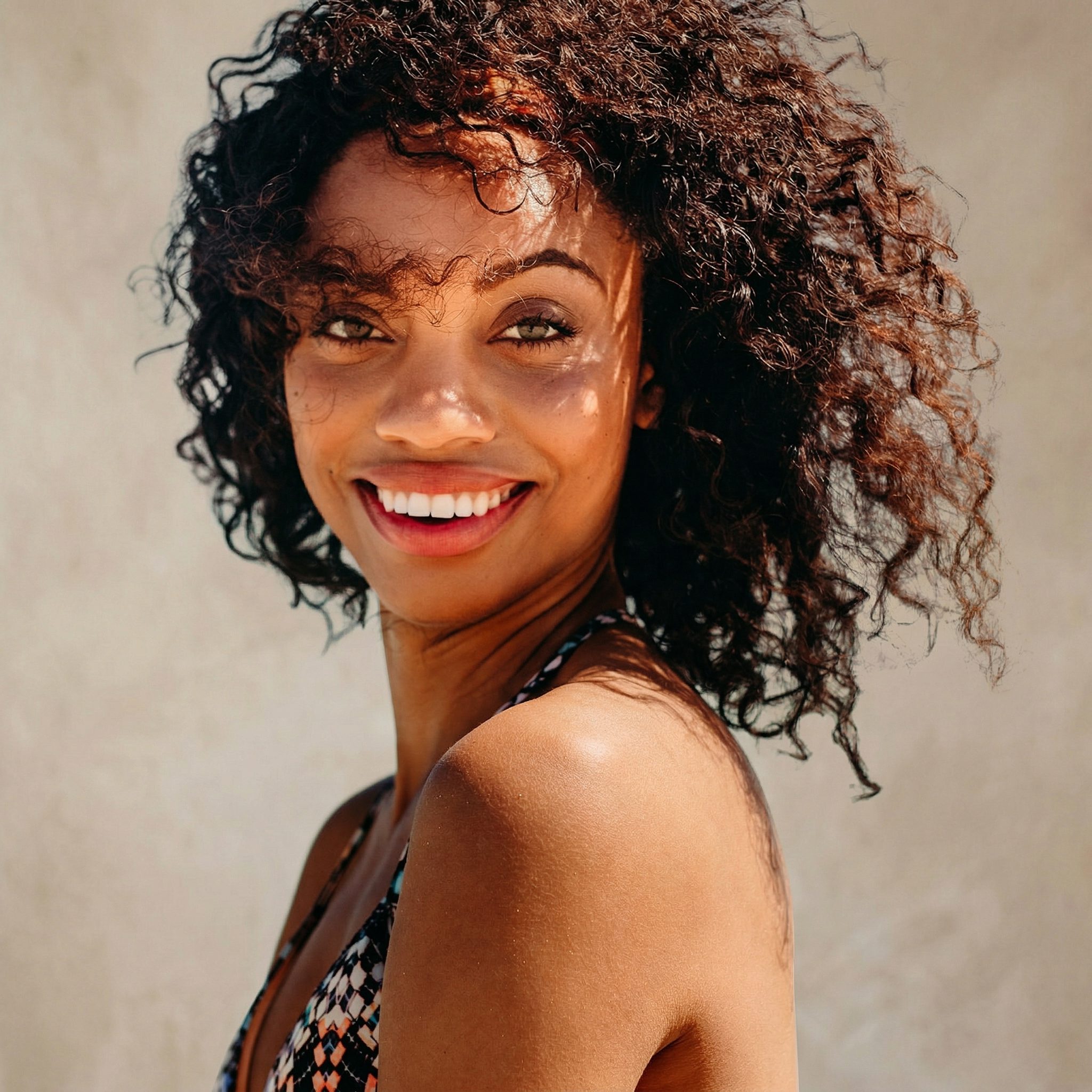 Microneedling collagen induction therapy — smiling woman with radiant, even-textured skin